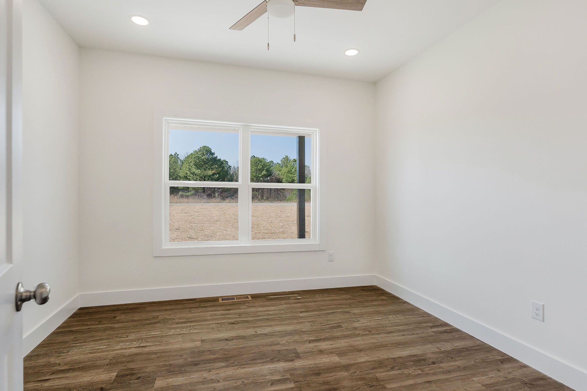 172 Johnson Chapel Road Sparta, TN 38583 - Photo 27 of 38 an empty room with wooden floor and windows