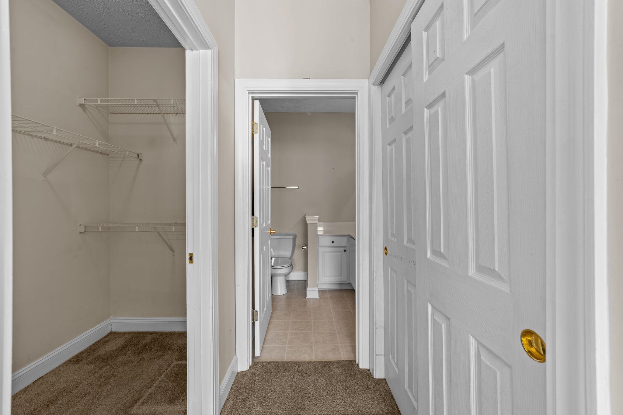 120 Fountain Pointe Lane, Unit 103 Myrtle Beach, SC 29579 - Photo 16 of 26 Hall featuring light carpet and light tile patterned floors