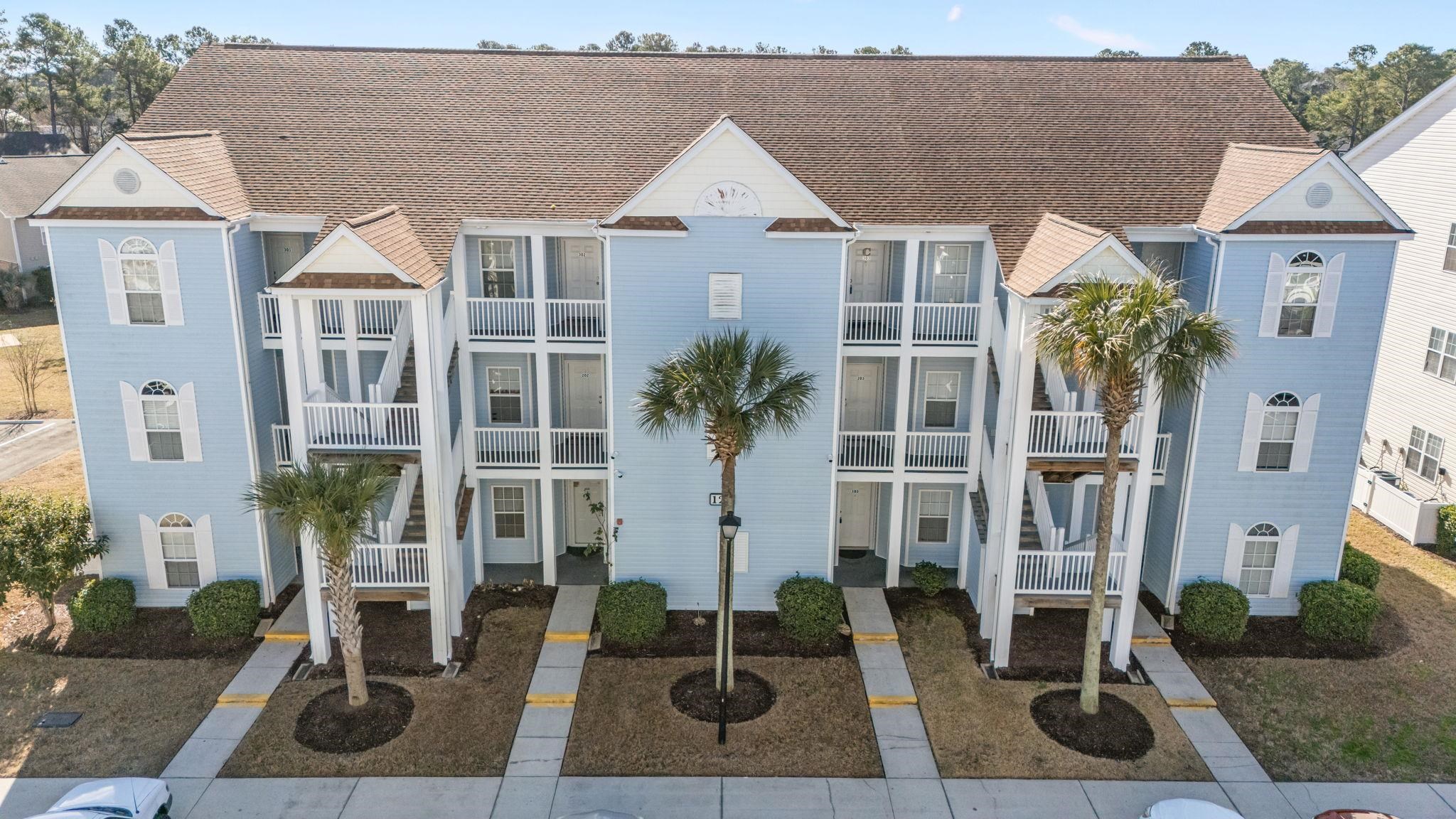 120 Fountain Pointe Lane, Unit 103 Myrtle Beach, SC 29579 - Photo 21 of 26 View of building exterior featuring stairway