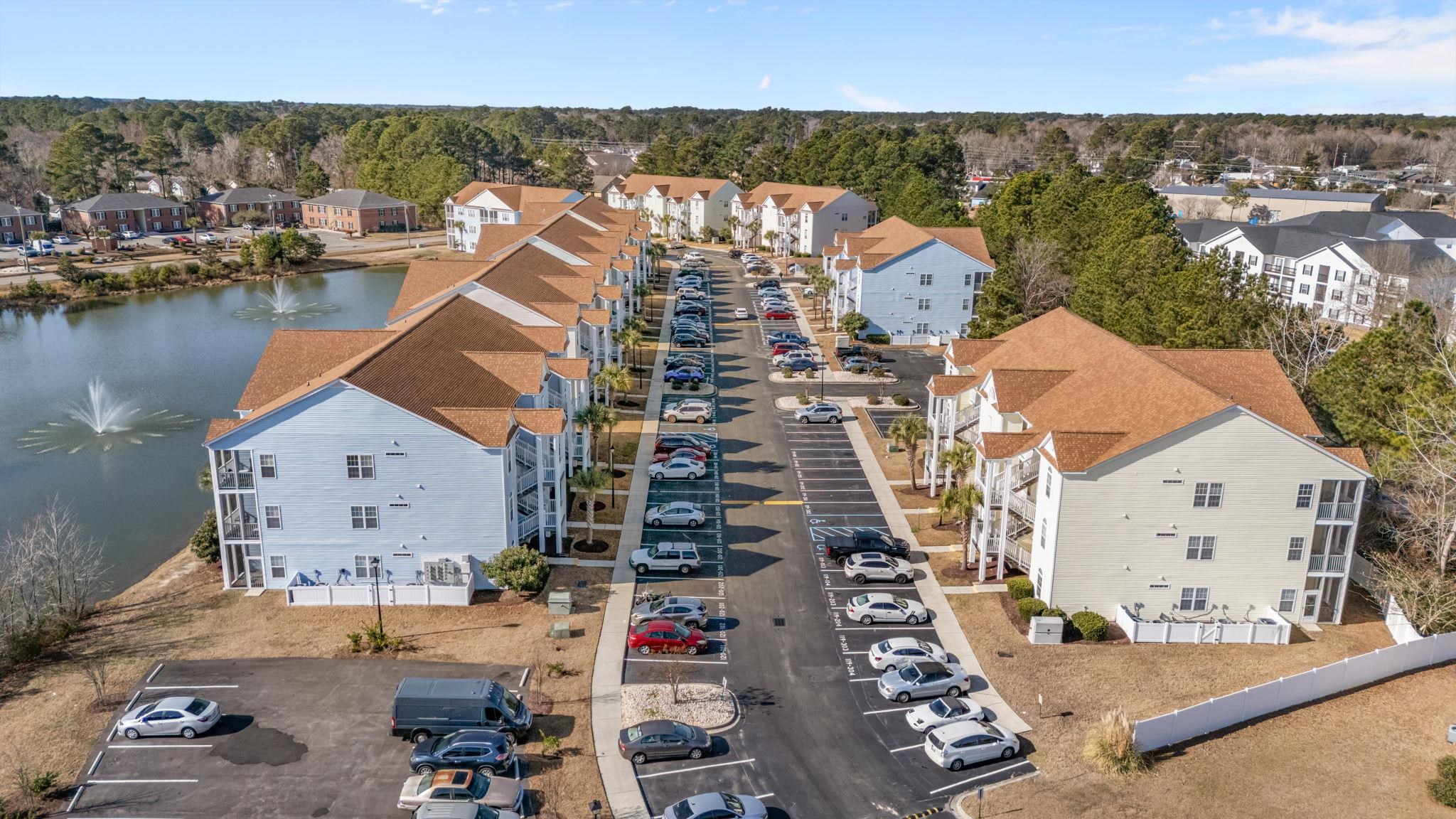 120 Fountain Pointe Lane, Unit 103 Myrtle Beach, SC 29579 - Photo 22 of 26 Aerial view of residential area featuring a large body of water