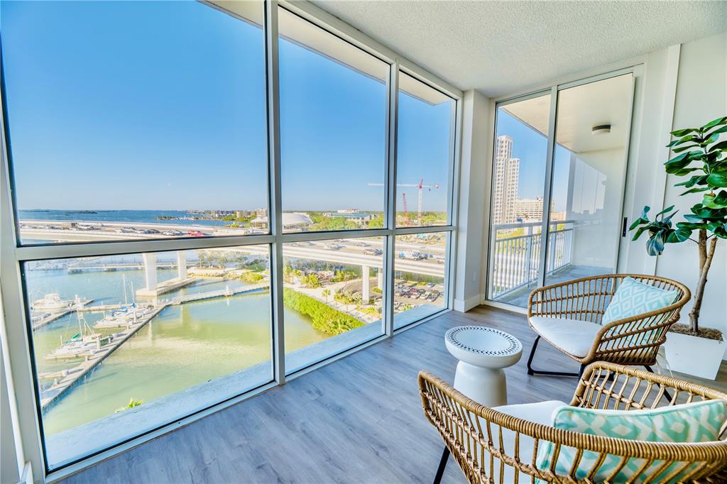 100 Pierce Street, Unit 1102 Clearwater, FL 33756 - Photo 19 of 45 a living room with furniture and a floor to ceiling window