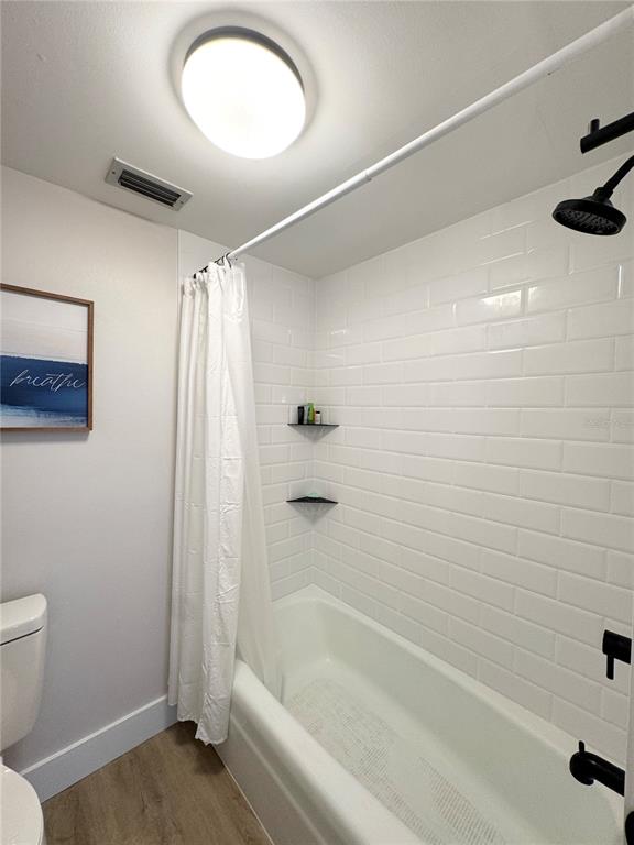100 Pierce Street, Unit 1102 Clearwater, FL 33756 - Photo 23 of 45 a bathroom with a shower and a toilet