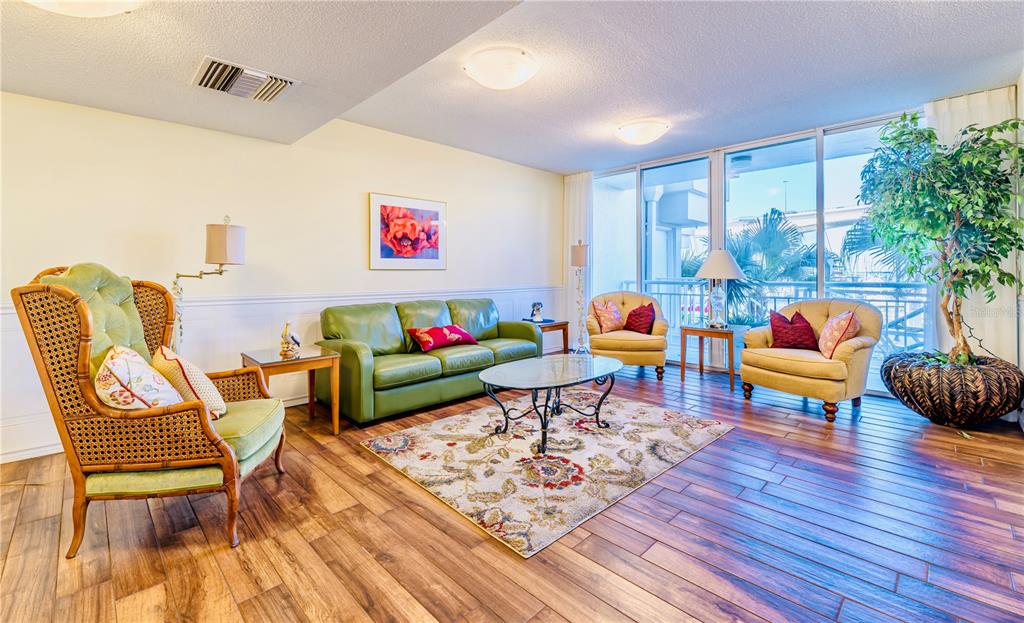 100 Pierce Street, Unit 1102 Clearwater, FL 33756 - Photo 28 of 45 a living room with furniture and wooden floor