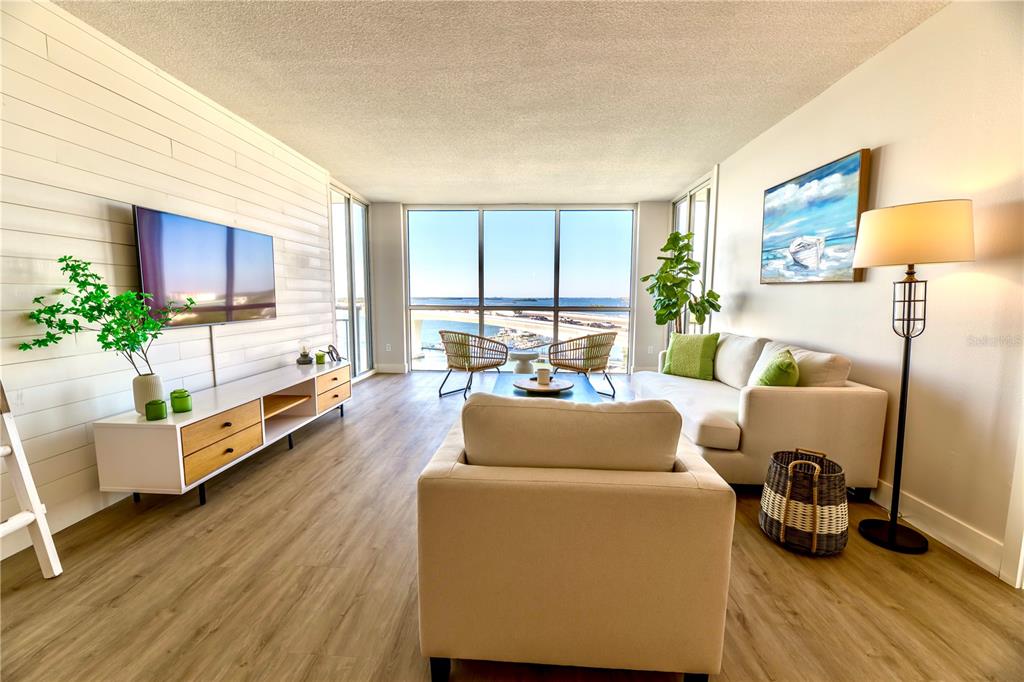 100 Pierce Street, Unit 1102 Clearwater, FL 33756 - Photo 4 of 45 a living room with furniture and a large window