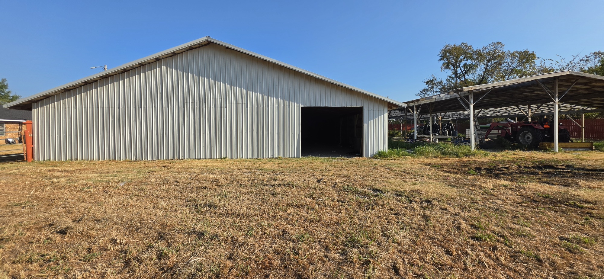 107903 South 4570 Road Sallisaw, OK 74955 - Photo 27 of 35 Metal outbuilding with a large open entrance