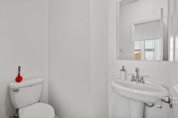 a bathroom with double sink and a mirror
