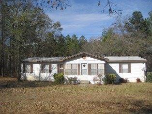 232 CC Camp Road Southwest Milledgeville, GA 31061 - Photo 1 of 1 a front view of a house with a garden