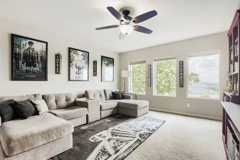 a living room with furniture and windows
