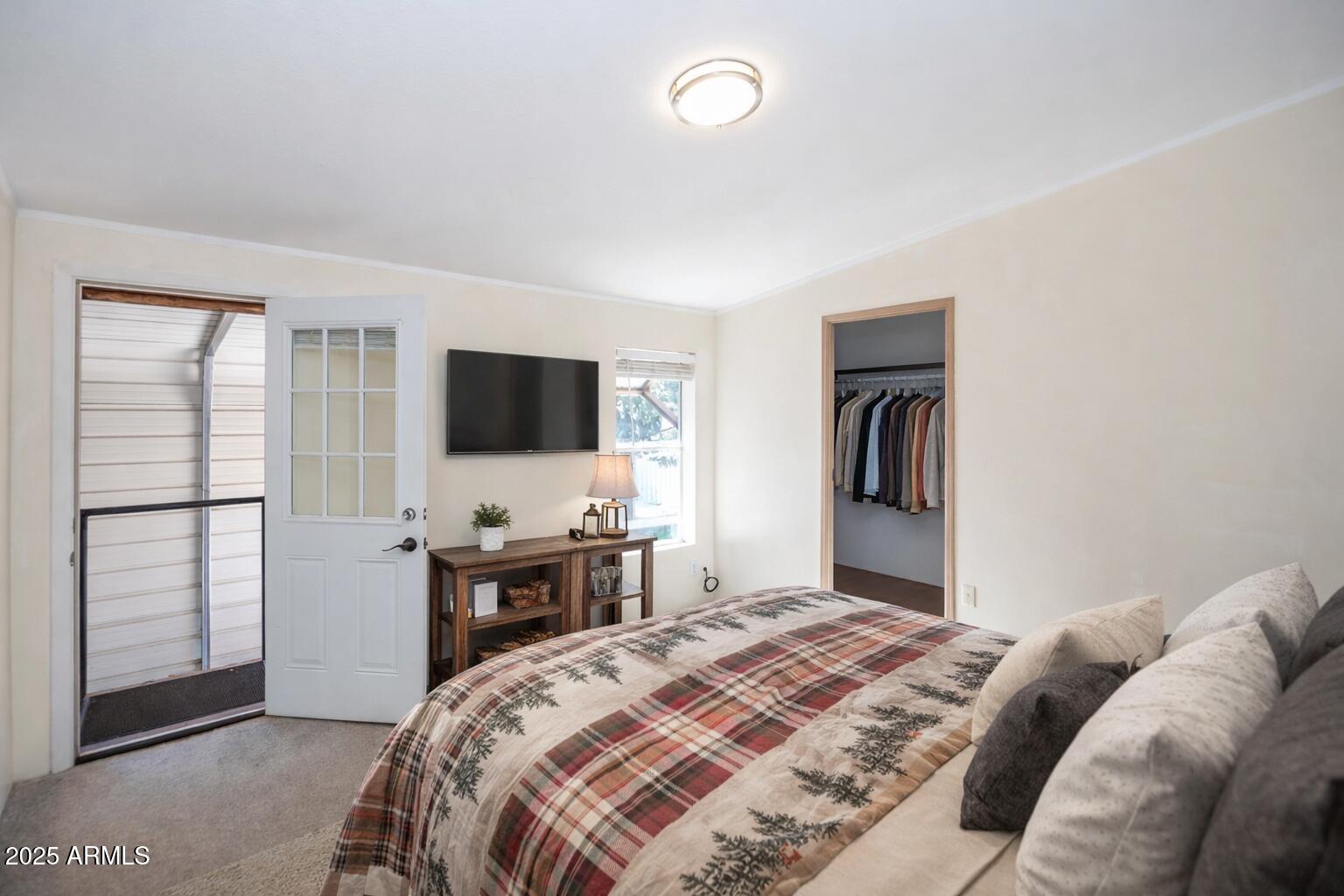 221 Standage Drive Payson, AZ 85541 - Photo 14 of 27 a bedroom with a bed and a flat tv screen on wall