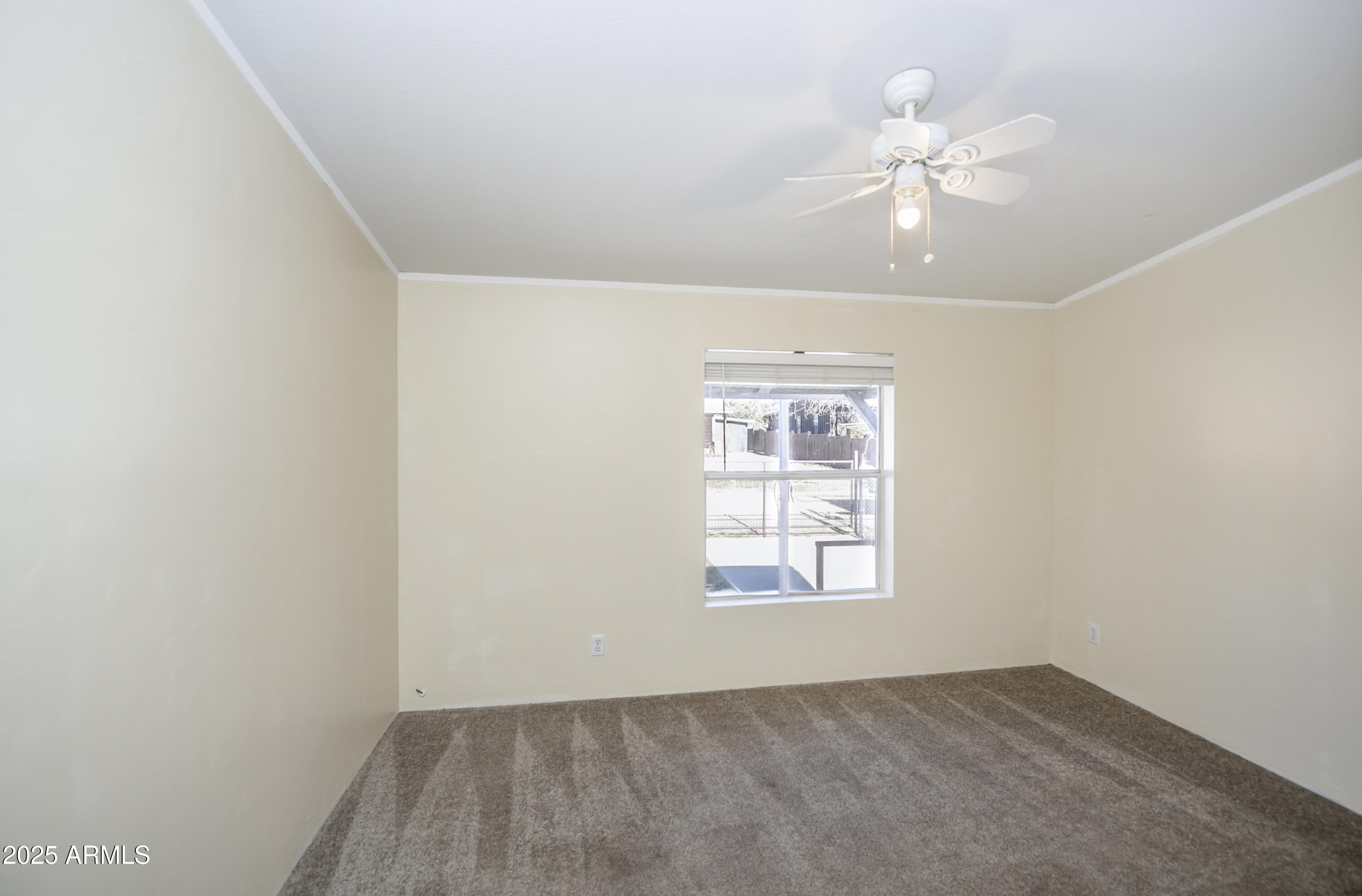 221 Standage Drive Payson, AZ 85541 - Photo 16 of 27 an empty room with windows and fan