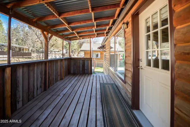 a view of balcony with wooden floor