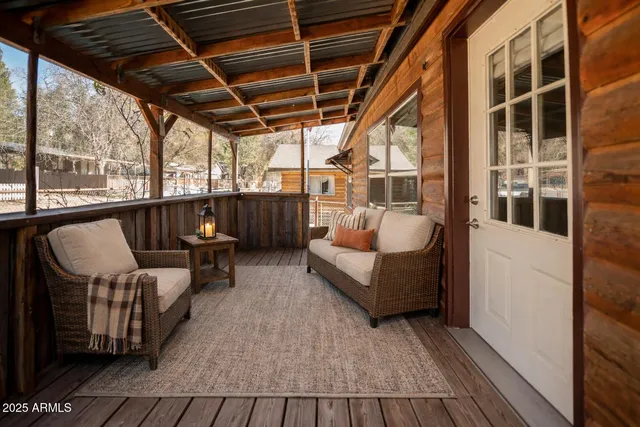 a balcony with furniture and a gate