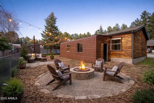 a view of a backyard with sitting area