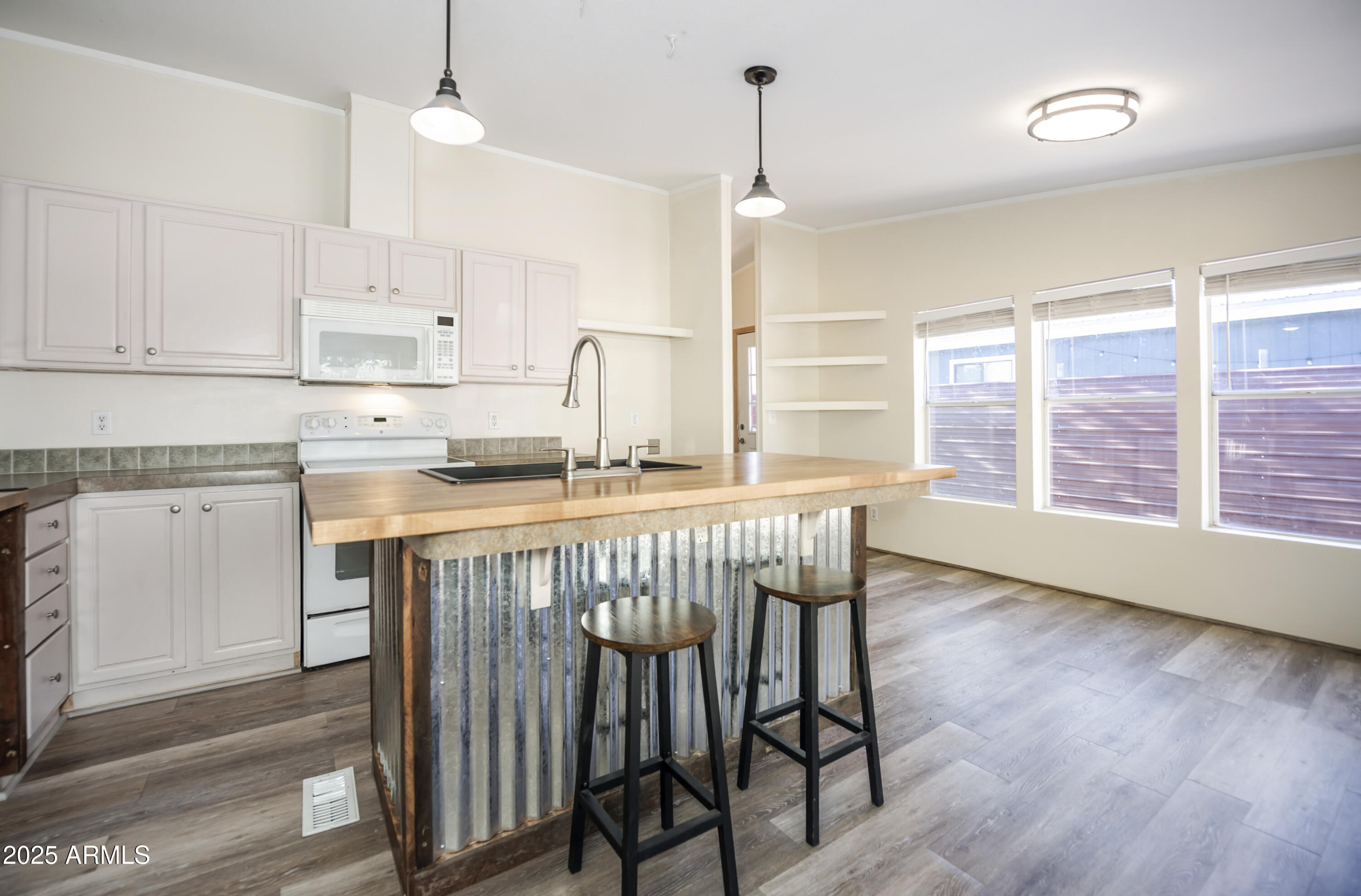 221 Standage Drive Payson, AZ 85541 - Photo 5 of 27 a kitchen with stainless steel appliances granite countertop a stove a sink a refrigerator and wooden floor