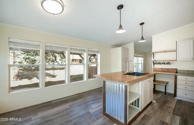 a kitchen that has a lot of cabinets in it
