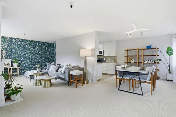 a living room with furniture and a table