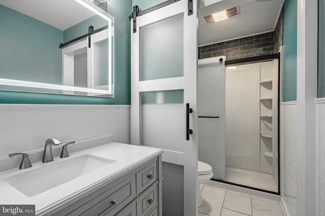 a bathroom with a sink and mirror