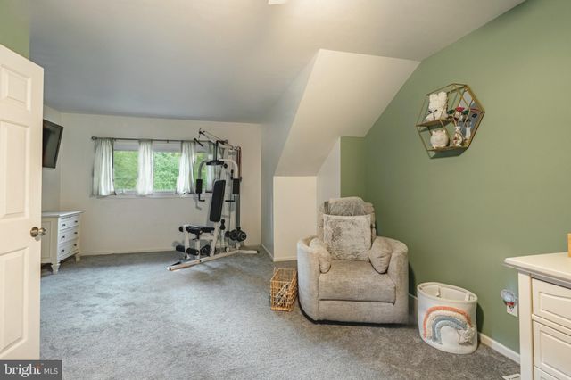 a room with a couch and a window