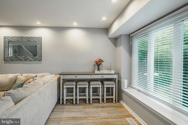a bedroom with furniture and window