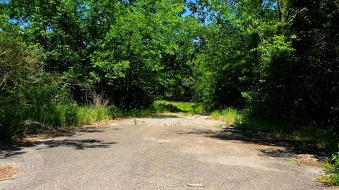 a view of backyard of a house