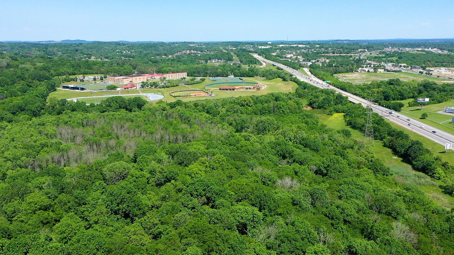 5 Peeples Court Madison, TN 37115 - Photo 5 of 31 a view of a city with lush green forest