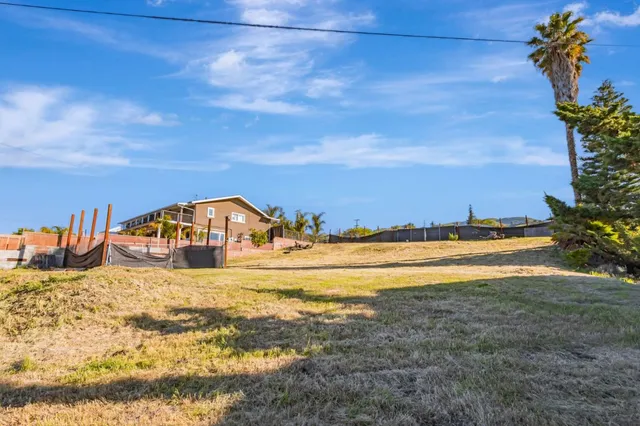 a view of a lake with a big yard