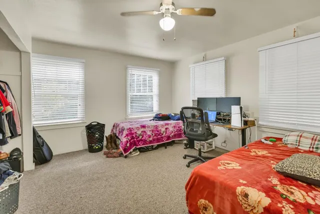 a bathroom with a sink toilet and a mirror