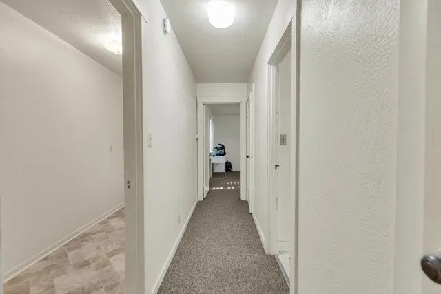 a view of a livingroom with furniture and a dining table