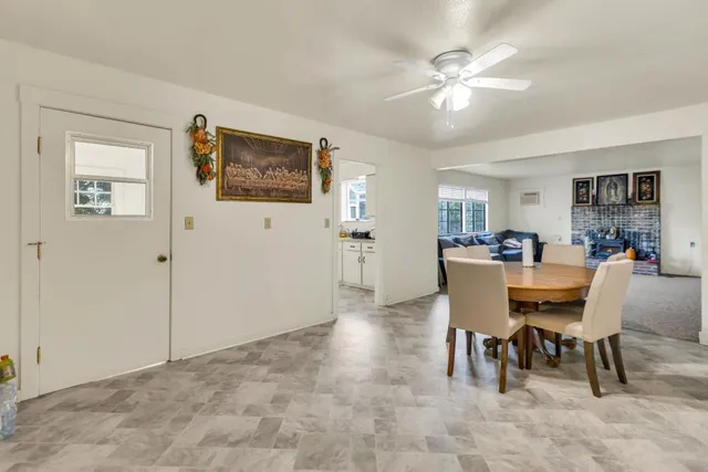 a view of a livingroom with furniture and a flat screen tv