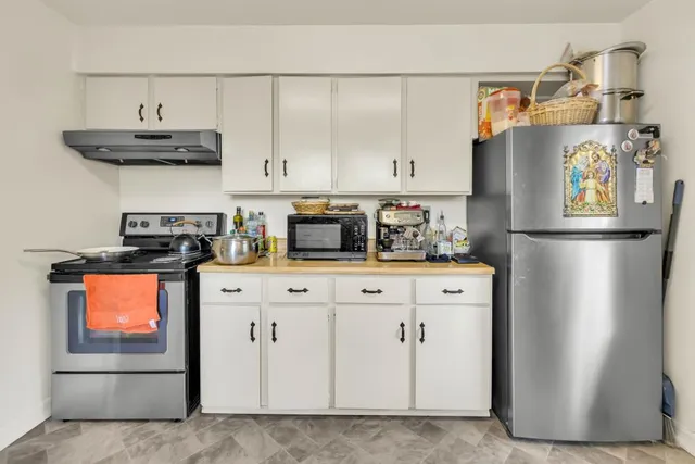 a bathroom with a sink toilet and mirror