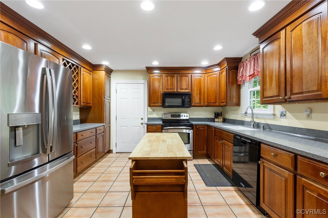 4018 Timber Ridge Road Midlothian, VA 23112 - Photo 12 of 43 a kitchen with stainless steel appliances granite countertop a refrigerator stove top oven and sink