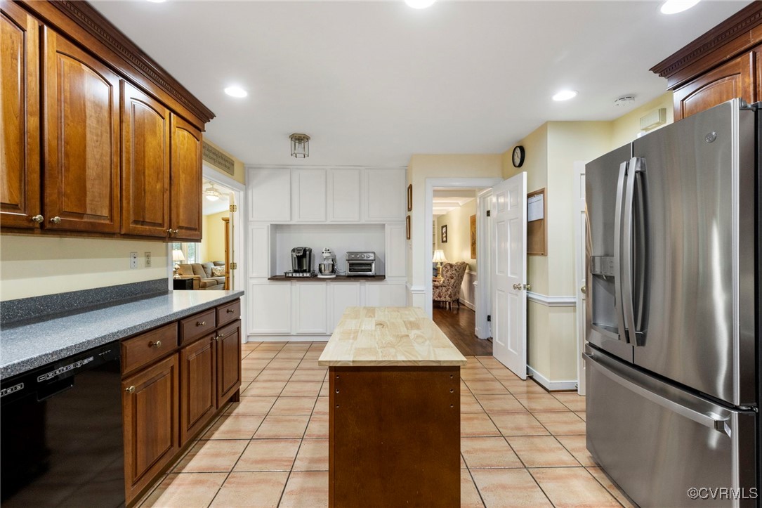 4018 Timber Ridge Road Midlothian, VA 23112 - Photo 14 of 43 a large kitchen with stainless steel appliances a refrigerator and a stove top oven