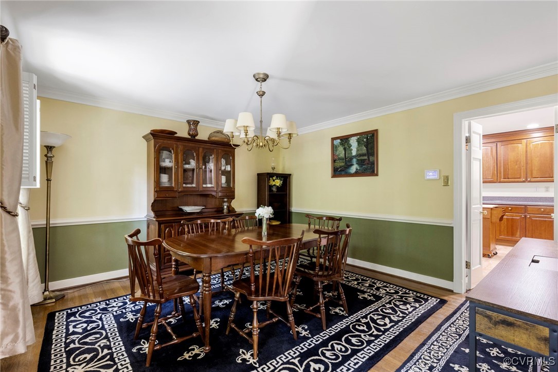 4018 Timber Ridge Road Midlothian, VA 23112 - Photo 6 of 43 a view of a dining room with furniture and chandelier