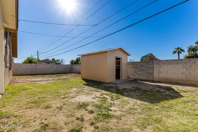 a view of a backyard of the house