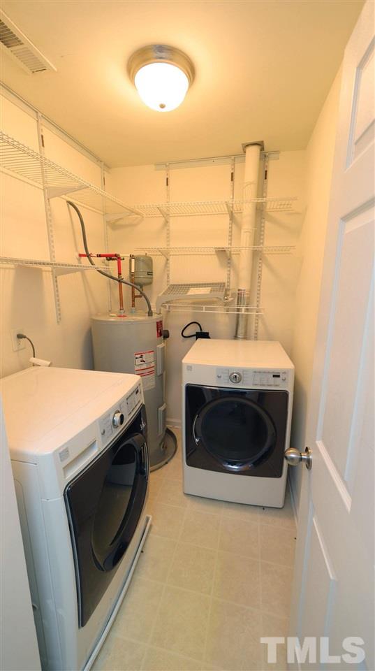 11710 Coppergate Drive, Unit 109 Raleigh, NC 27614 - Photo 14 of 15 a utility room with dryer and washer