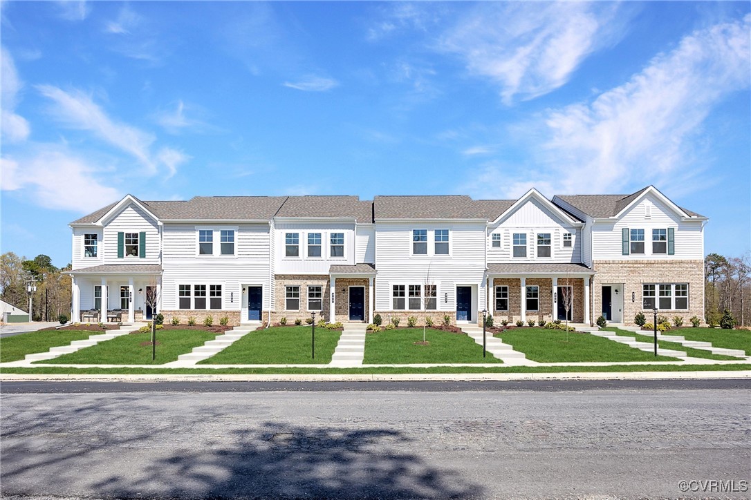 233 Greenpark Road Sandston, VA 23150 - Photo 24 of 30 a view of a big house with a big yard and potted plants