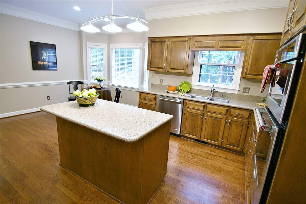 2001 Countrywood Road North Raleigh, NC 27615 - Photo 6 of 25 Large breakfast area looks out onto the gorgeous backyard Kitchen