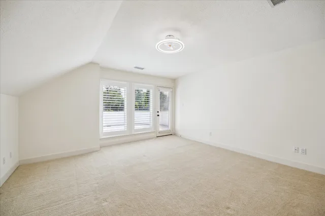 a bathroom with a granite countertop sink a toilet a shower and a mirror