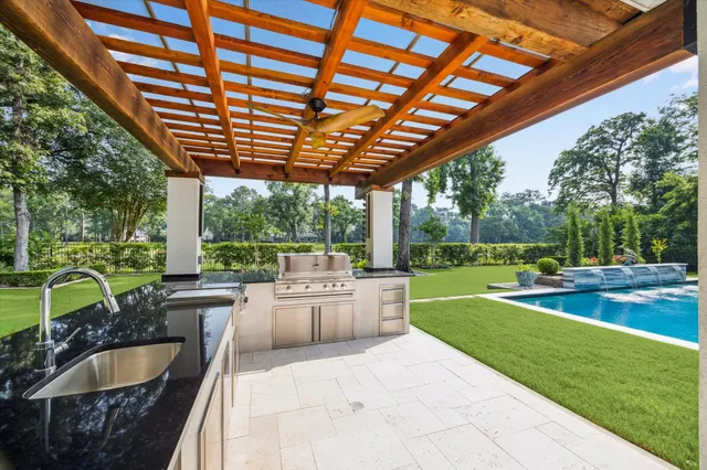 a view of an house with swimming pool and sitting area
