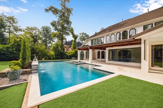 a view of a field of grass and trees