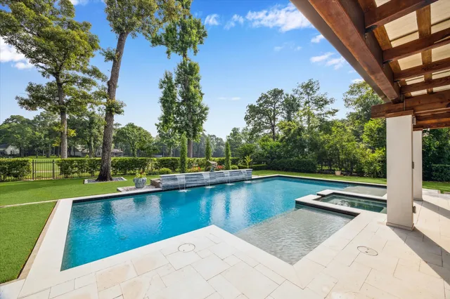 a view of a swimming pool with a lake view