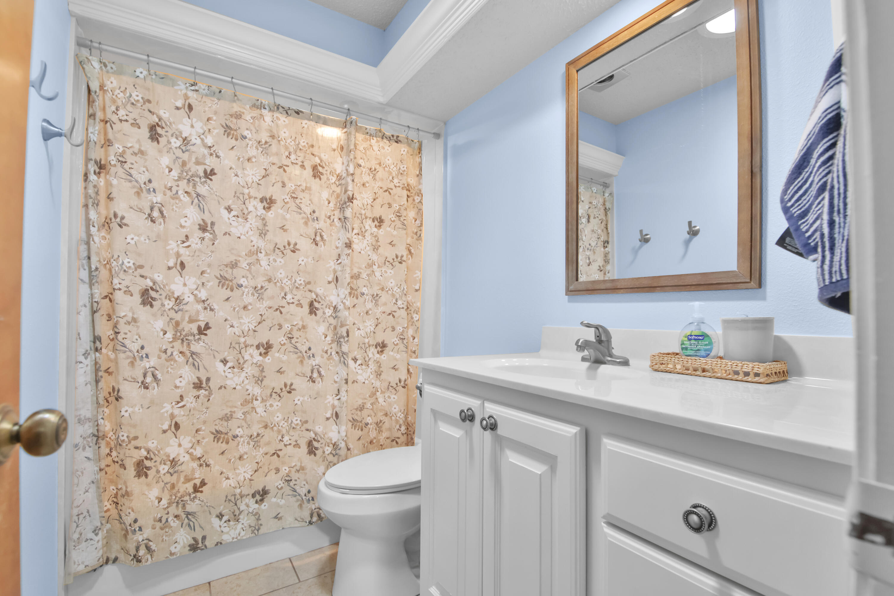 4805 73rd Street Lubbock, TX 79424 - Photo 20 of 26 a bathroom with a sink toilet and shower