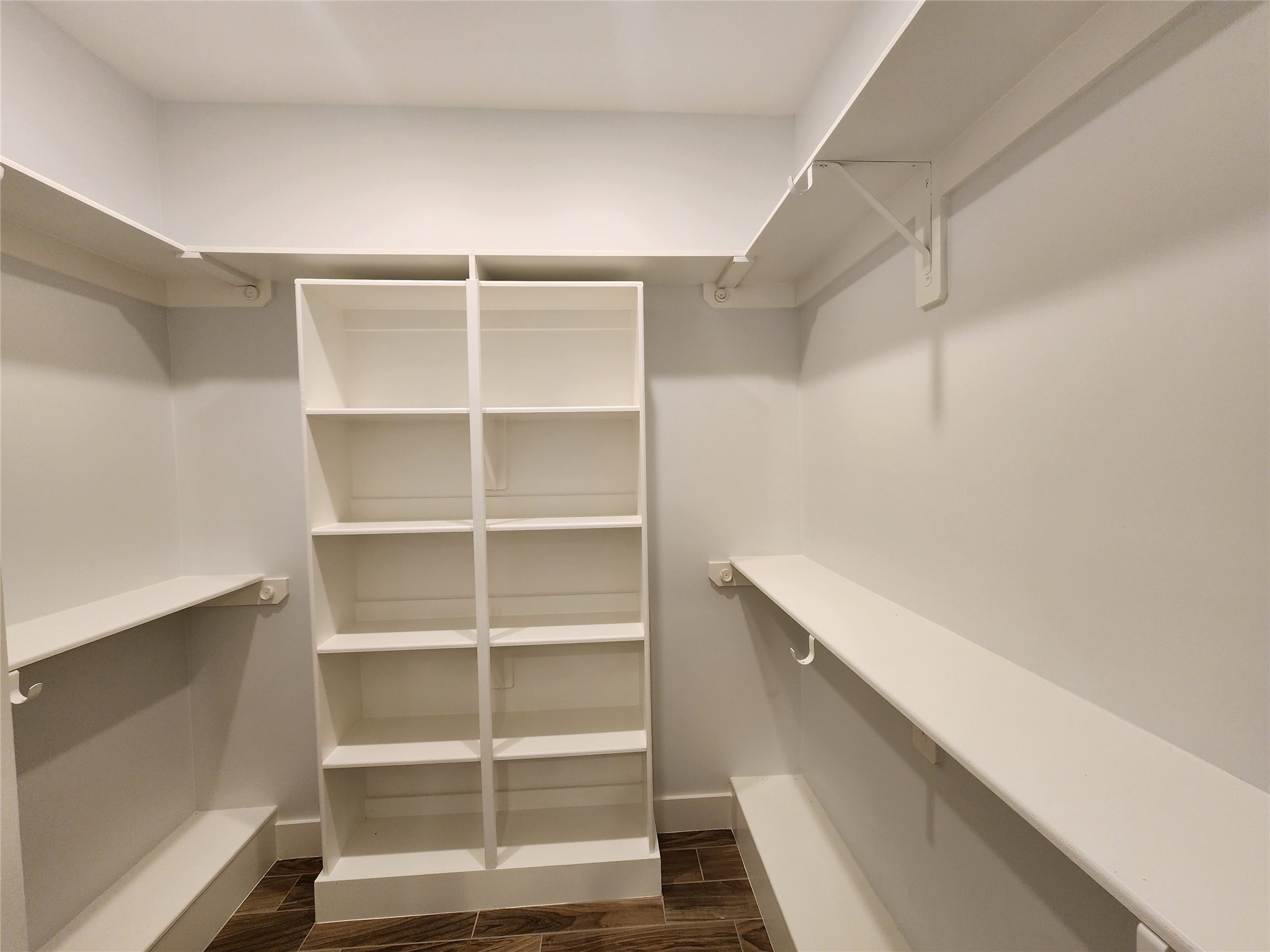25982 Lantern Lane New Caney, TX 77357 - Photo 18 of 26 a view of walk in closet with empty racks