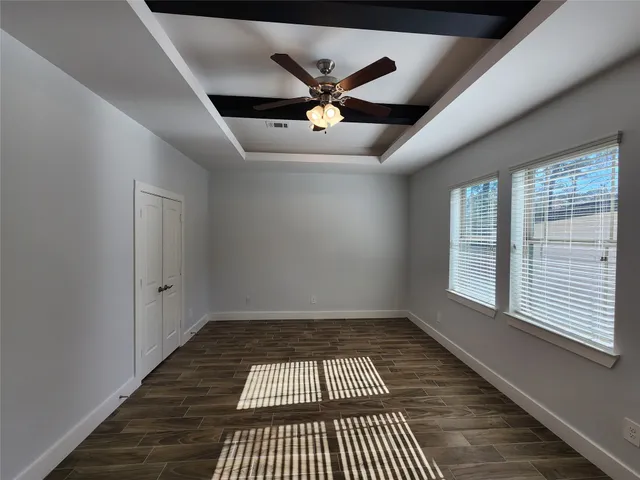 a very nice looking room with a ceiling fan