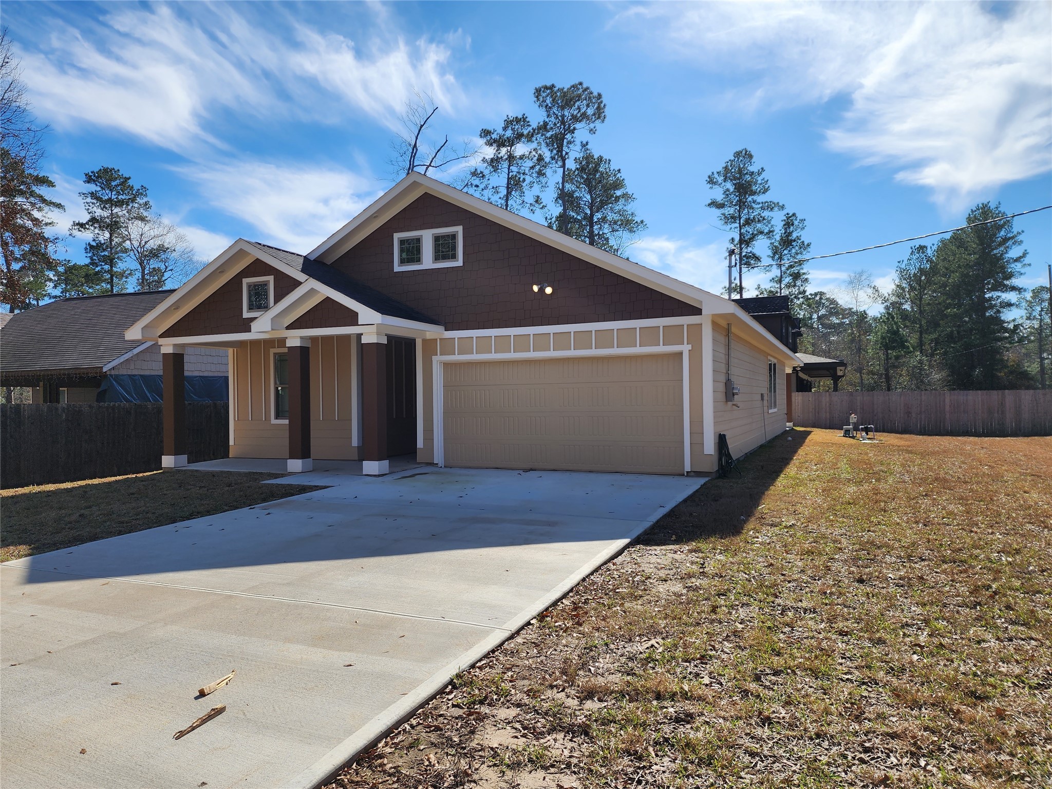 25982 Lantern Lane New Caney, TX 77357 - Photo 25 of 26 a front view of a house with a yard and garage
