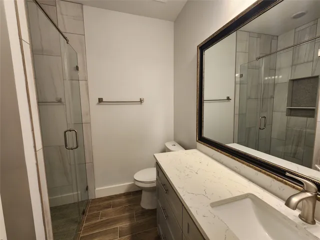 a bathroom with a sink and toilet