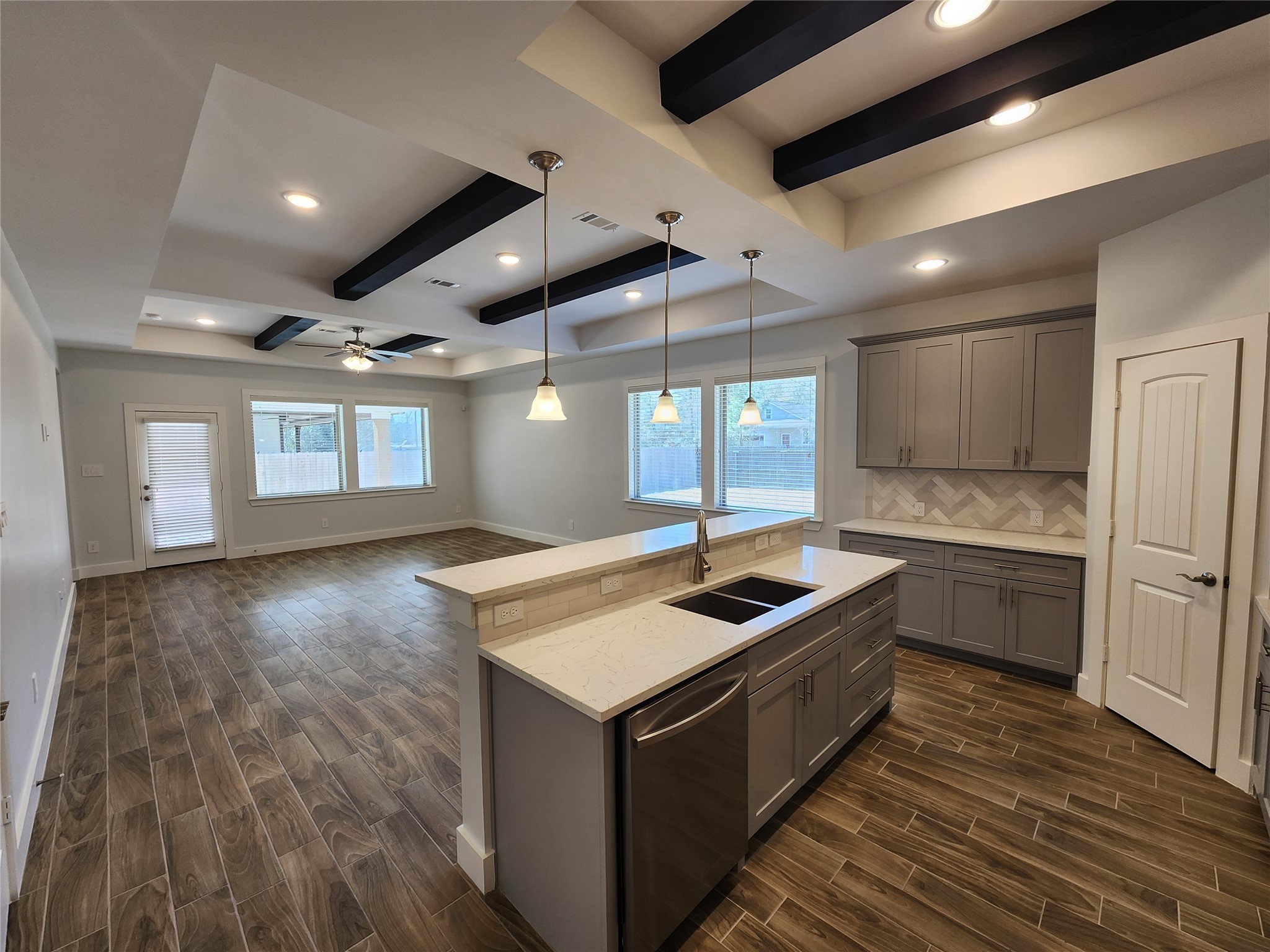25982 Lantern Lane New Caney, TX 77357 - Photo 8 of 26 a kitchen with a stove sink and cabinets