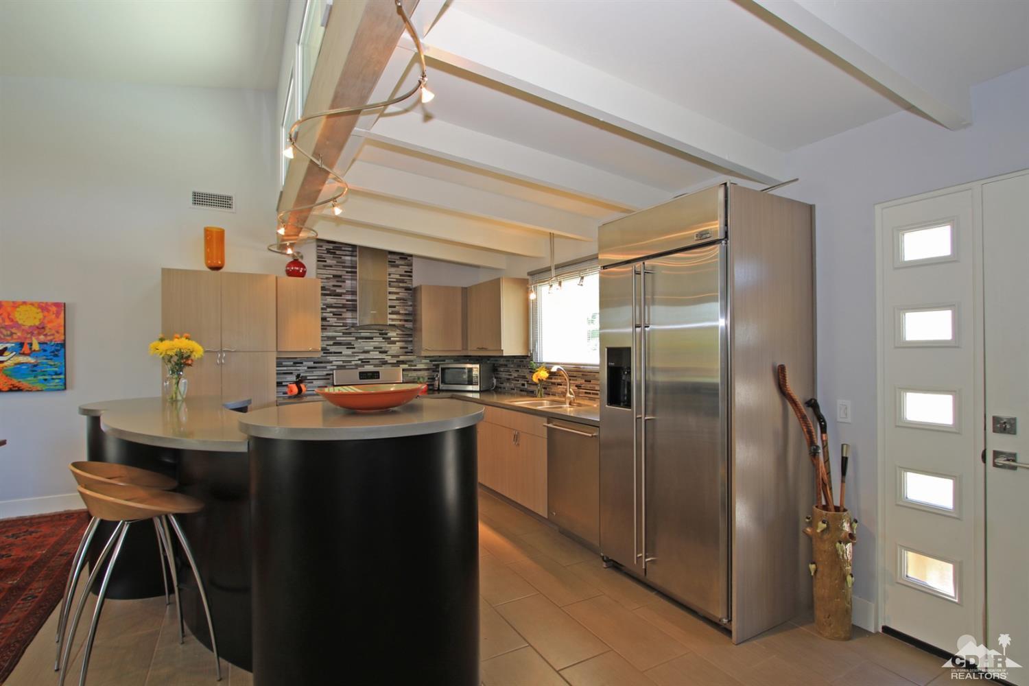 71728 Tunis Road Rancho Mirage, CA 92270 - Photo 1 of 44 a kitchen with stainless steel appliances granite countertop a sink and a refrigerator
