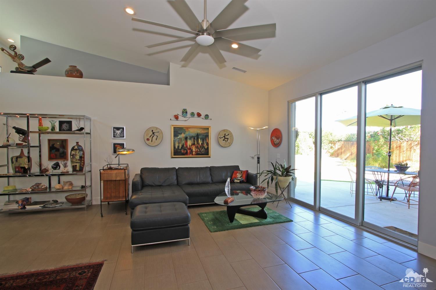 71728 Tunis Road Rancho Mirage, CA 92270 - Photo 2 of 44 a living room with furniture and a large window
