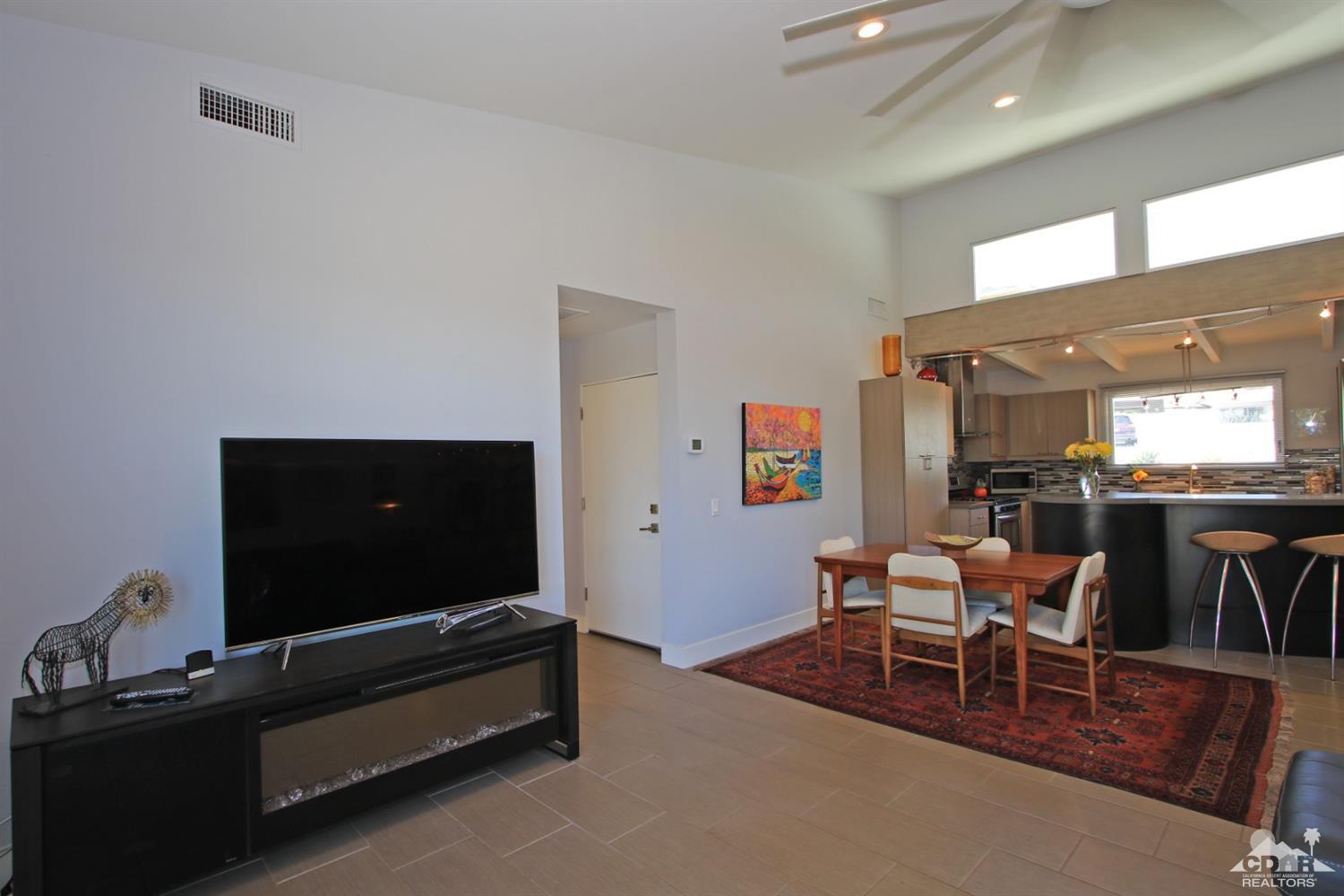71728 Tunis Road Rancho Mirage, CA 92270 - Photo 11 of 44 a living room with furniture and a flat screen tv